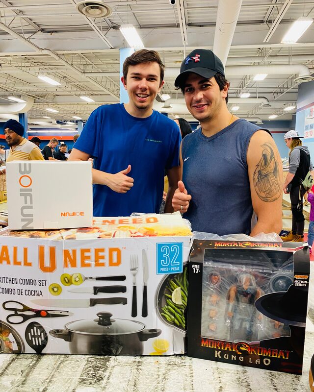 A shopper with a boxed liquidation find at Krazy Binz