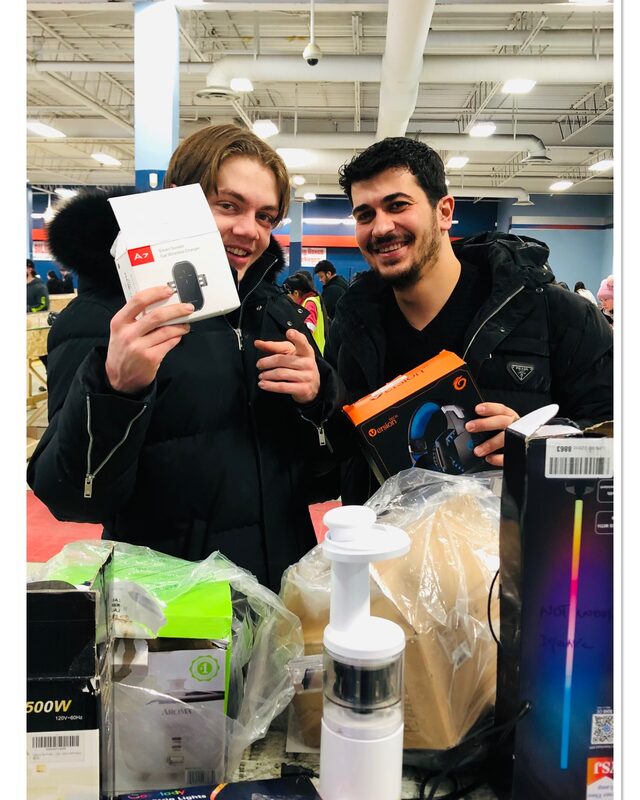 Two Krazy Binz shoppers with their haul of finds